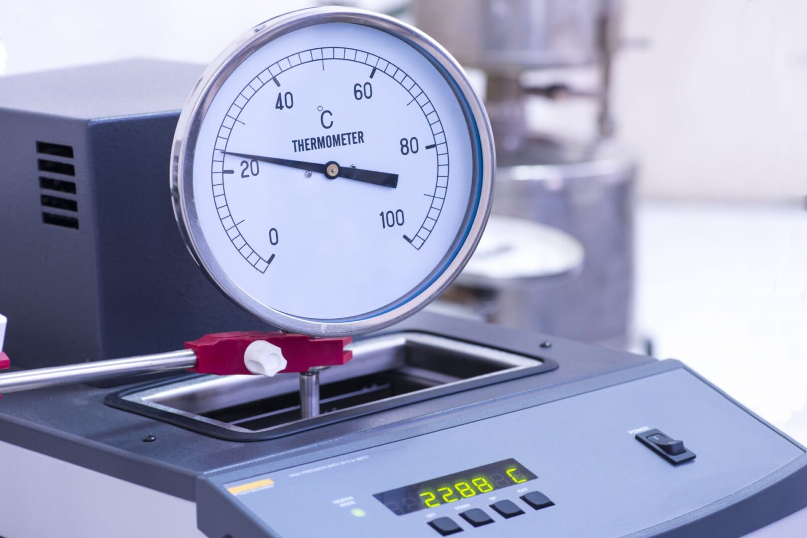 A thermometer is shown on top of a machine.