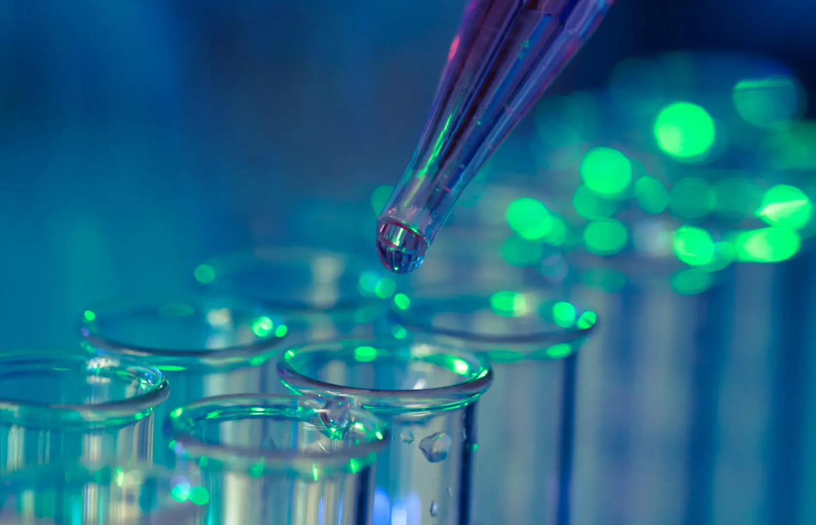 A glass beaker is being filled with liquid.